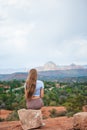 Girl enjoys the view of the Sedona landscape from the top of the Bell Rock hiking trail, famous for its many energy Royalty Free Stock Photo