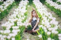 Beautiful girl holding bouquet flowers .Portrait in nature field