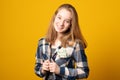 Beautiful young girl is holding dollars in her shirt pocket. Happy teen girl with money Royalty Free Stock Photo