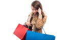 Beautiful girl holding gift bags while doing shopping Royalty Free Stock Photo