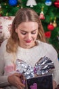 Beautiful girl holding a gift box. Christmas, Time of miracles Royalty Free Stock Photo