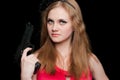 Beautiful girl holding a gun Royalty Free Stock Photo