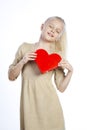 Beautiful girl holding heart in arms Royalty Free Stock Photo