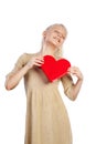 Beautiful girl holding heart in arms. Royalty Free Stock Photo