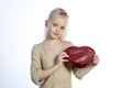 Beautiful girl holding heart in arms Royalty Free Stock Photo