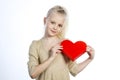 Beautiful girl holding heart in arms Royalty Free Stock Photo