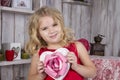 Beautiful girl holding a heart-shaped box Royalty Free Stock Photo