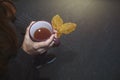 Beautiful girl holding mug of hot tea and leaves in hands. Autumn mood, fall concept Royalty Free Stock Photo