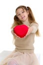 Beautiful girl holding red heart