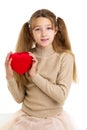 Beautiful girl holding red heart