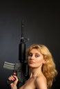 Beautiful girl holding a rifle Royalty Free Stock Photo