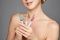 Beautiful girl holding syringes Royalty Free Stock Photo