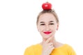 Beautiful girl holding a tomato in her hands, on a white isolated background. The concept of a healthy diet and diet. Royalty Free Stock Photo