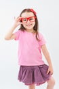 Beautiful girl holds a hand frame for the red glasses. Royalty Free Stock Photo