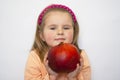 The beautiful girl holds a huge pomegranate in han