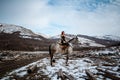 Beautiful girl on horse and with red hair in armor. Woman is a Viking. Fantasy