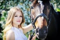 Beautiful girl and horse in spring garden Royalty Free Stock Photo