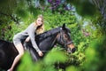 Beautiful girl and horse in spring garden Royalty Free Stock Photo