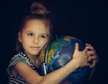 Beautiful girl hugging a globe Royalty Free Stock Photo