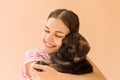 Beautiful girl hugging tight her cute small puppy Royalty Free Stock Photo
