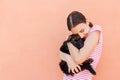 Beautiful girl hugging tight her cute small puppy Royalty Free Stock Photo