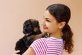 Beautiful girl hugging tight her cute small puppy Royalty Free Stock Photo