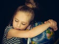 Beautiful girl hugs the globe and calmly asleep Royalty Free Stock Photo