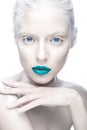 Beautiful girl in the image of albino with blue lips and white eyes. Art beauty face. Royalty Free Stock Photo