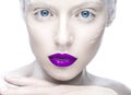 Beautiful girl in the image of albino with purple lips and white eyes. Art beauty face.