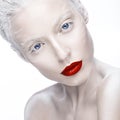 Beautiful girl in the image of albino with red lips and white eyes. Art beauty face.