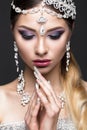 Beautiful girl in image of Arab bride with expensive jewelry, oriental make-up and bridal manicure. beauty face.