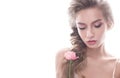 Beautiful girl in image of bride with flower. Model with nude makeup and a rose in her hand.