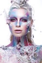 Beautiful girl in the image of a snowy unicorn creature. Creative make up. Art look. Royalty Free Stock Photo