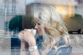 Beautiful girl inside a cafe with cup of coffee Royalty Free Stock Photo