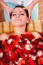 Beautiful girl in jacuzzi with rose petal. Royalty Free Stock Photo