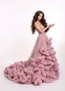 Beautiful girl Lady in luxury lush pink dress. Fashion brunette Royalty Free Stock Photo