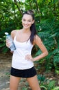 Beautiful girl laughing holding a bottle of water Royalty Free Stock Photo