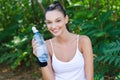 Beautiful girl laughing holding a bottle of water Royalty Free Stock Photo