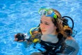 Young woman taking a scuba diving lesson in a resort pool Royalty Free Stock Photo