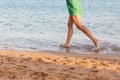 Beautiful girl legs running on the beach. pretty girl walking on water Royalty Free Stock Photo