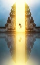 Beautiful Girl Levitating Near Gates Of Heaven In Pura Lempuyang Temple In Bali, Indonesia.