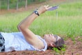 Beautiful girl lies on meadow and reads the book Royalty Free Stock Photo