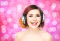 Beautiful girl listening to the music throughout headphones Royalty Free Stock Photo