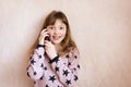 Little girl is talking on a mobile phone. Royalty Free Stock Photo