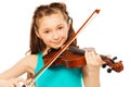 Beautiful girl with long hair playing on violin Royalty Free Stock Photo