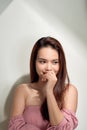 beautiful girl with long hair wearing pink cotton blouse Royalty Free Stock Photo