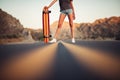 Beautiful girl with long legs enjoys a ride on a longboard at summertime. Outdoors sports activities.