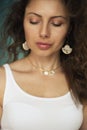 Beautiful girl with long wavy hair . Brunette with closed eyes and curly hairstyle Royalty Free Stock Photo