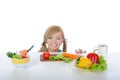 Beautiful girl looking for fresh vegetables Royalty Free Stock Photo