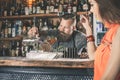 Beautiful girl looking at handsome bartender Royalty Free Stock Photo